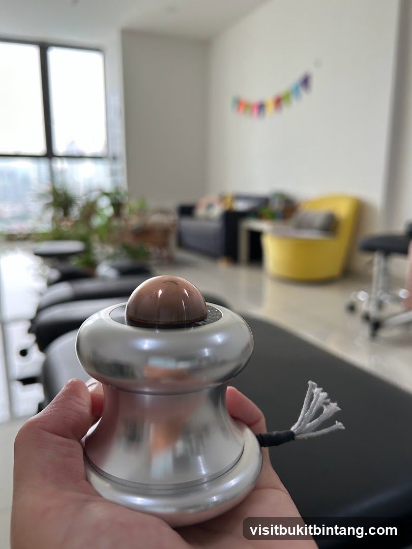 Hand holding a massage device