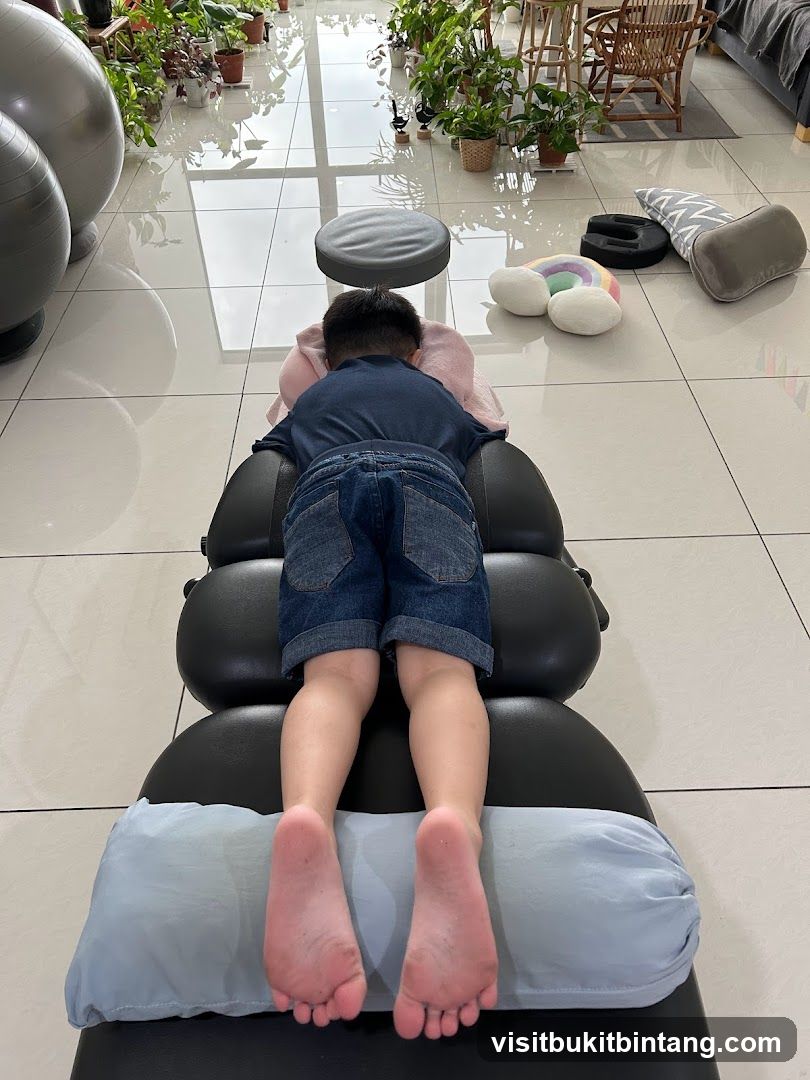 Child lying on massage table