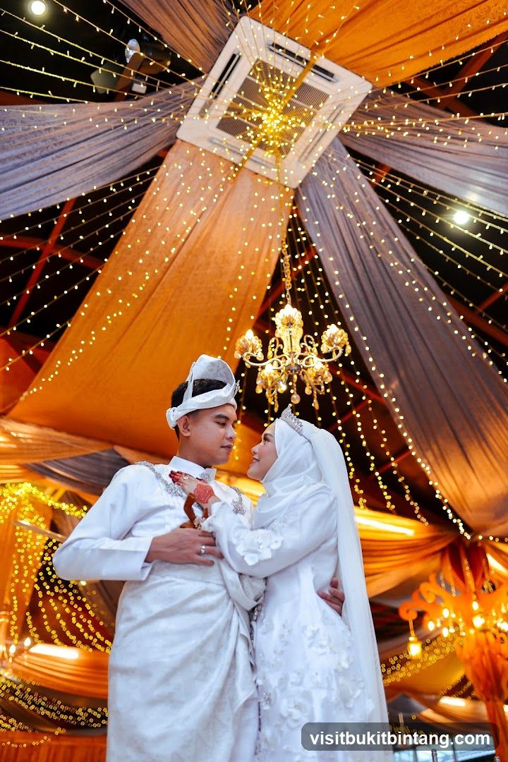 Wedding Couple Posing Under Drapes and Lights
