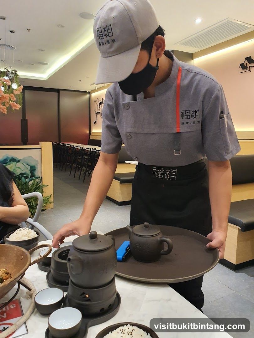 Waiter serving tea