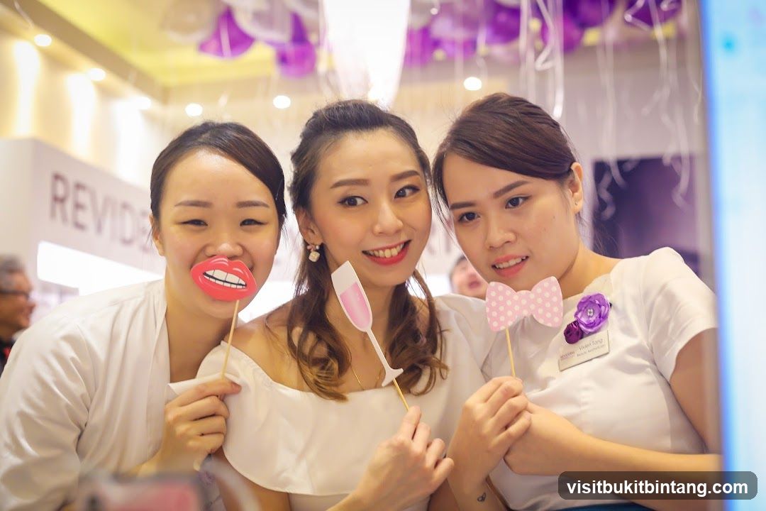 Three Women Posing with Props