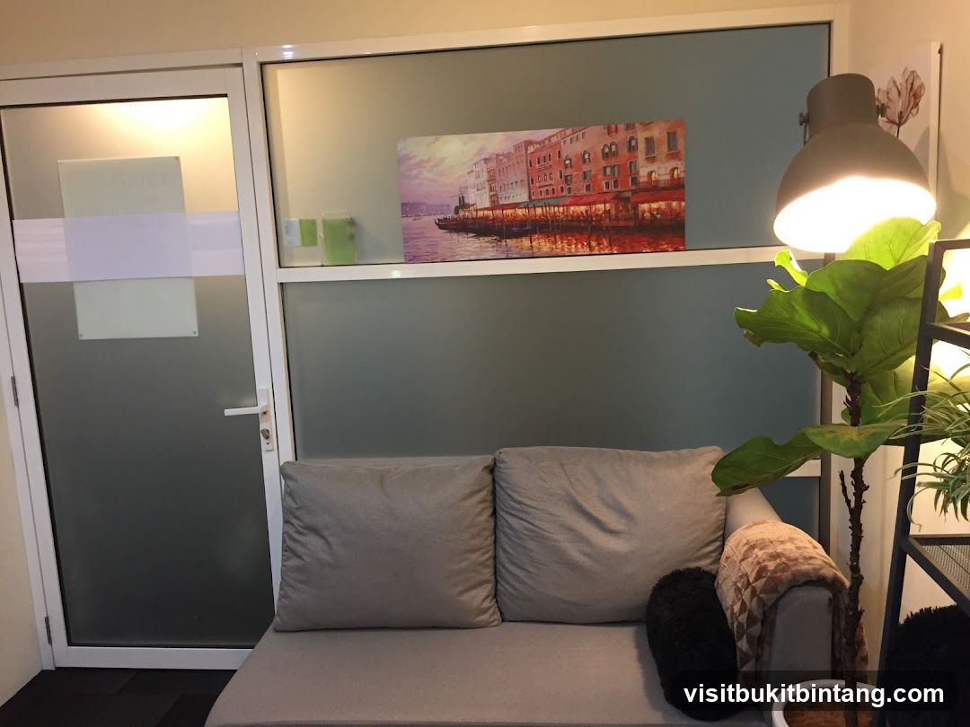 Waiting area with artwork and plant