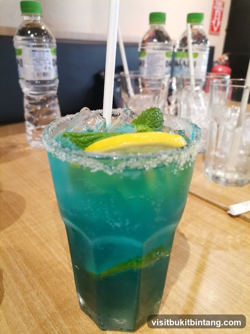 Blue Cocktail with Mint and Lemon