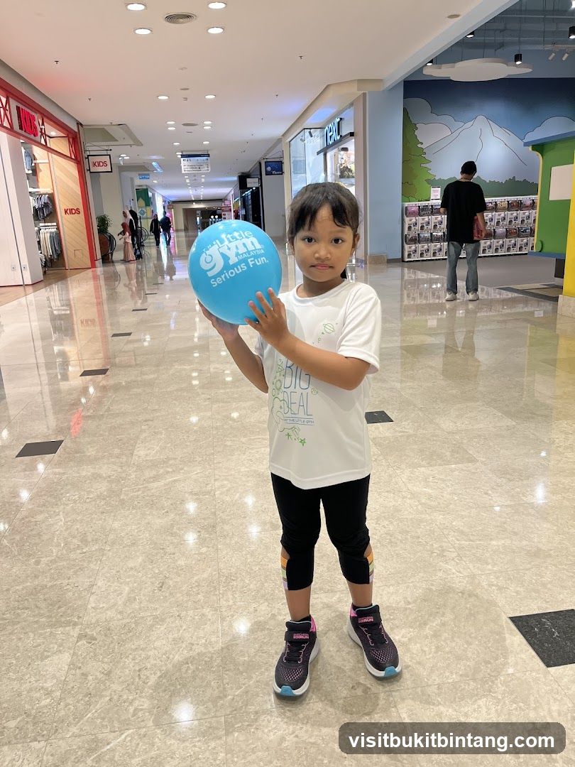 Girl Holding a Blue Balloon