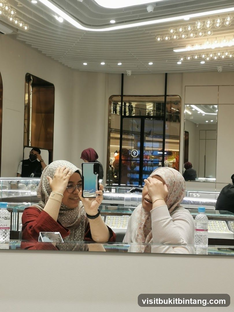 Two women taking a selfie in a jewelry store