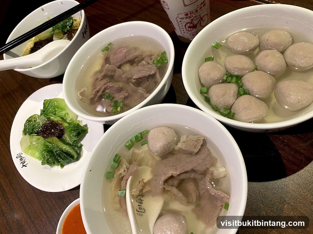 Bowls of Noodle Soup and Side Dishes