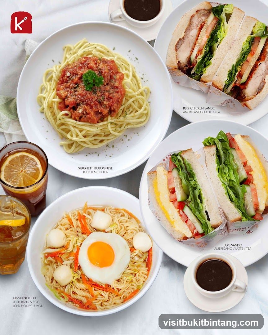 Food spread with noodles, sandwiches, and drinks