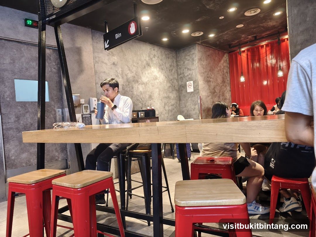 People sitting at a counter in a cafe