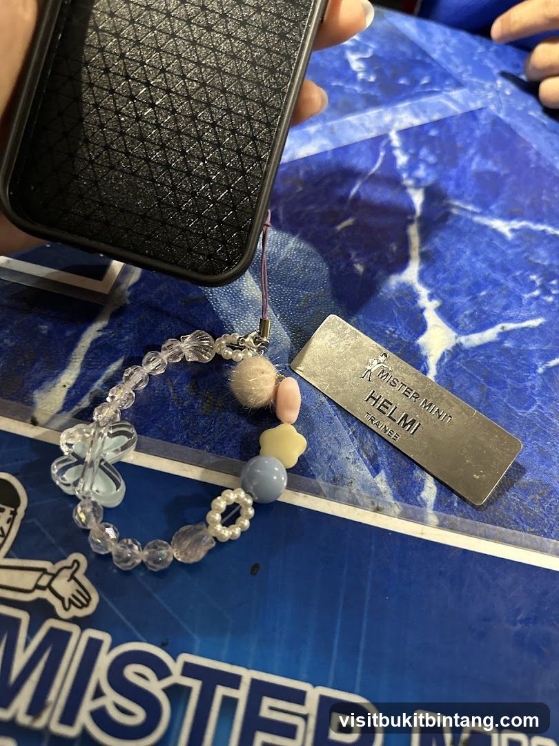 Phone with charm and name tag