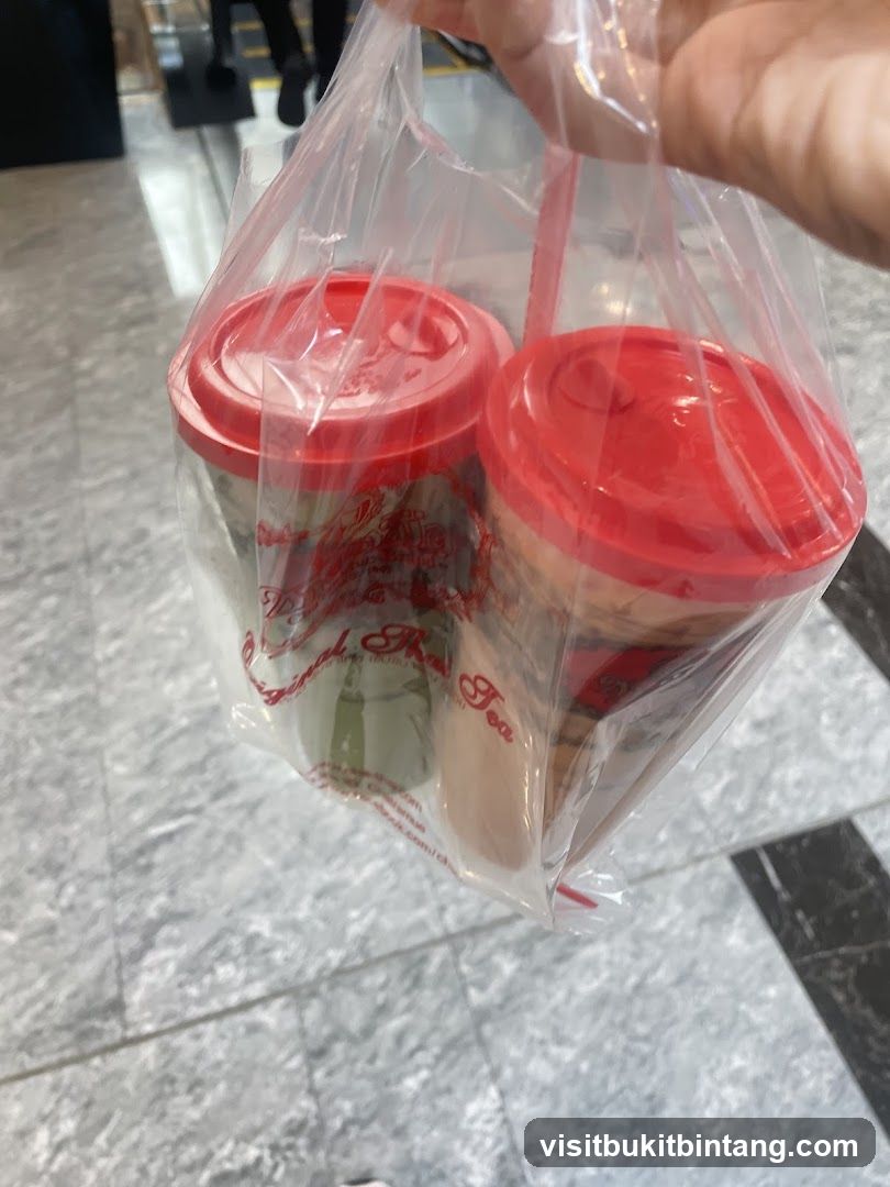 Two drinks in a plastic bag