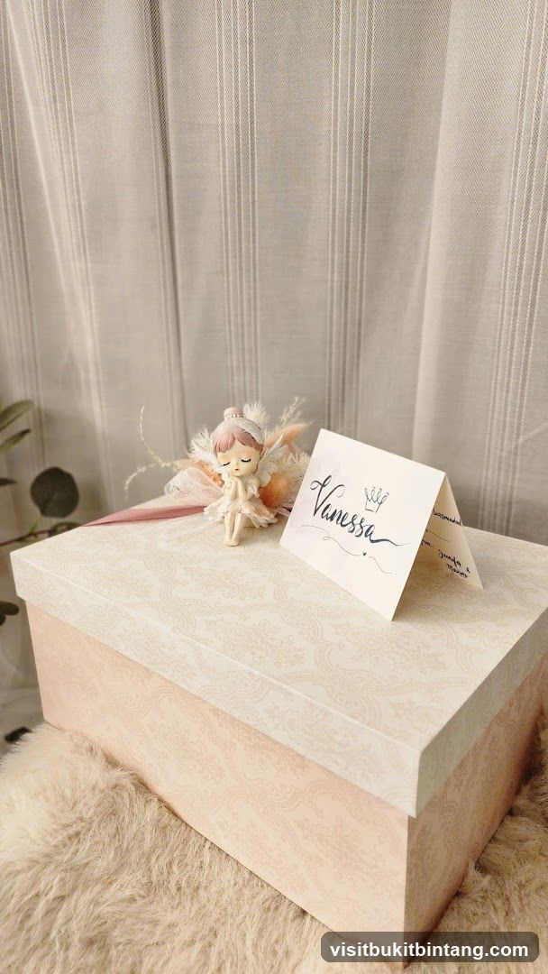Gift box with fairy figurine and name card
