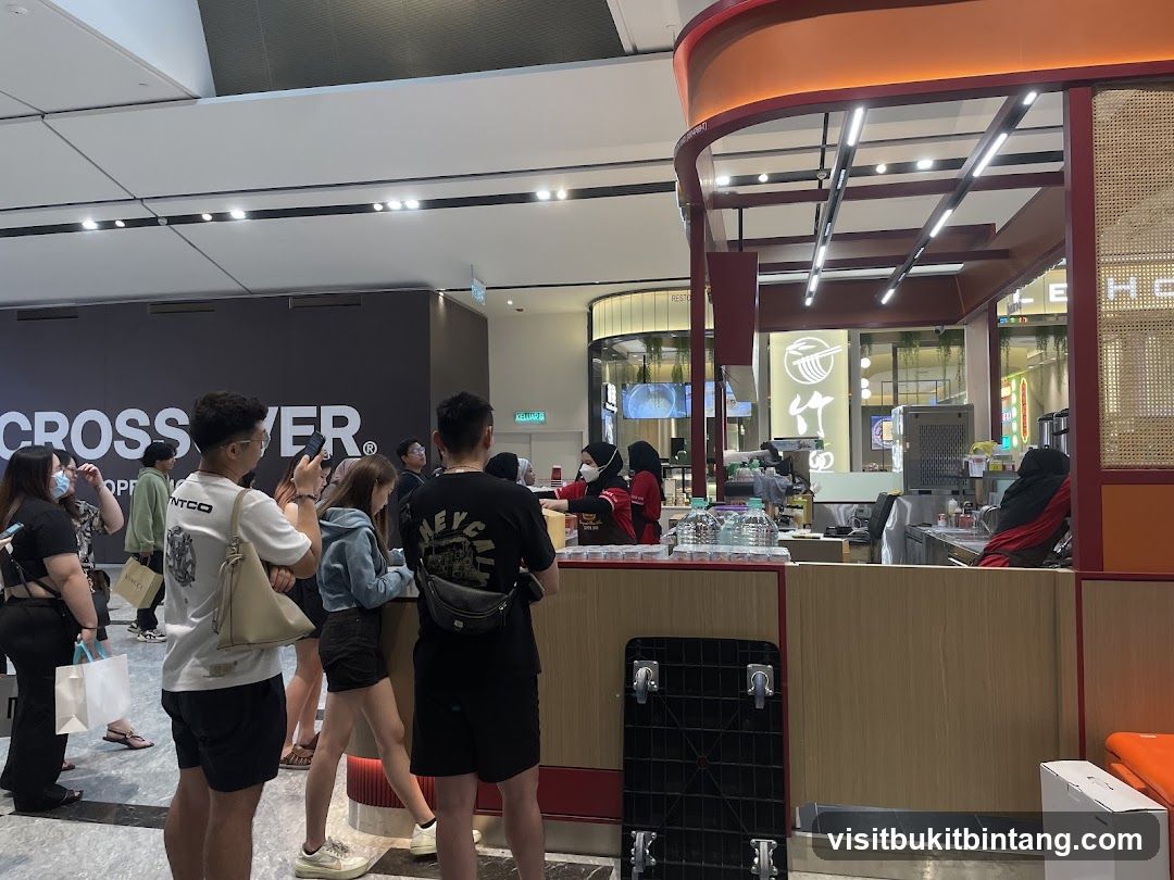 People queuing at a food stall