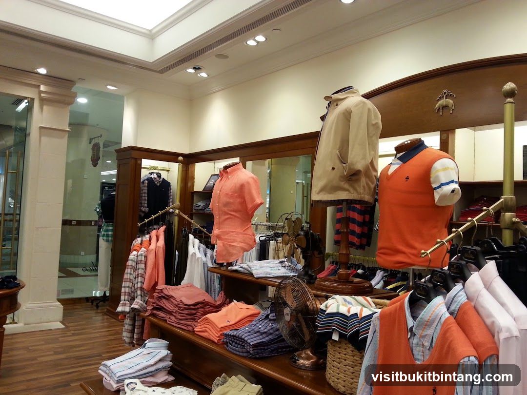 Clothing store interior with mannequins and folded shirts