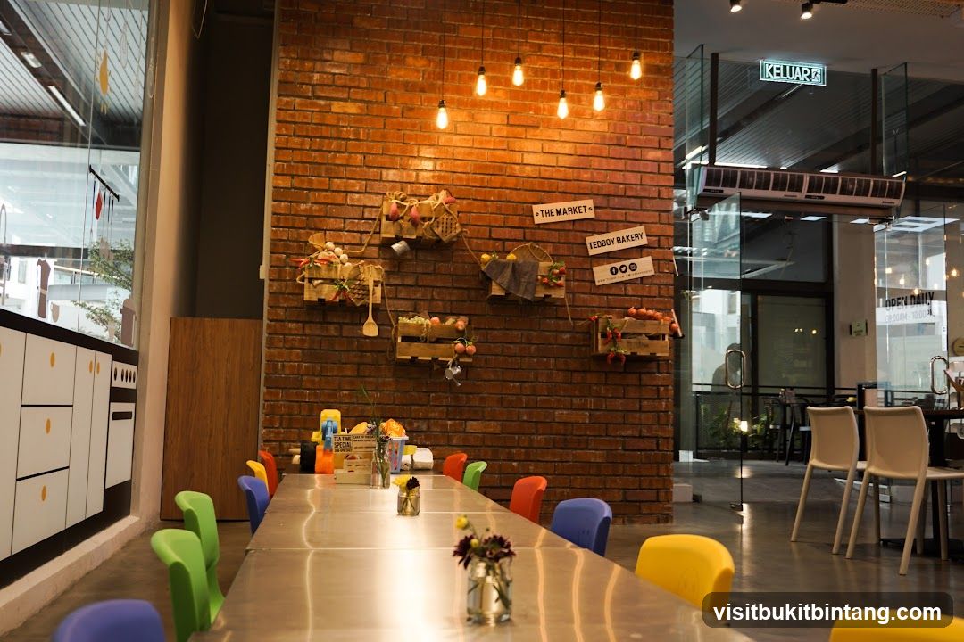 Interior of a cafe with colorful chairs and brick wall