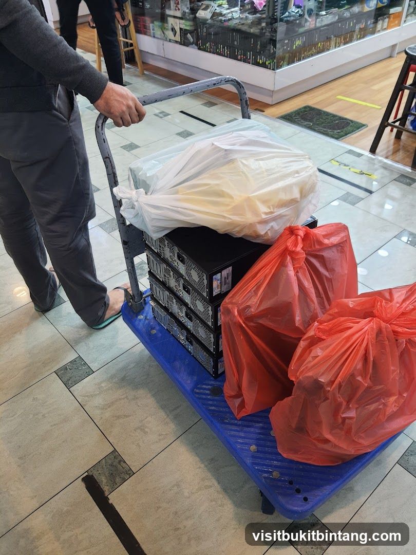 Person pushing a cart with electronics
