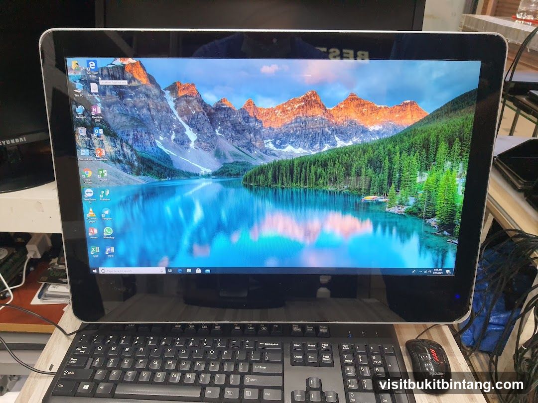 All-in-one computer with a mountain lake wallpaper