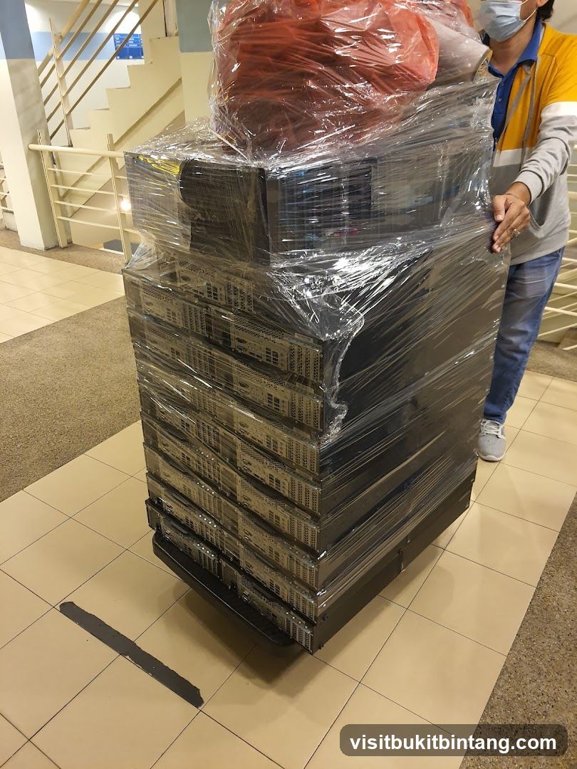 Person moving stacked servers