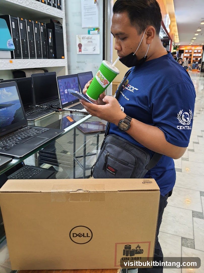 Man with Dell Laptop Box and Drink