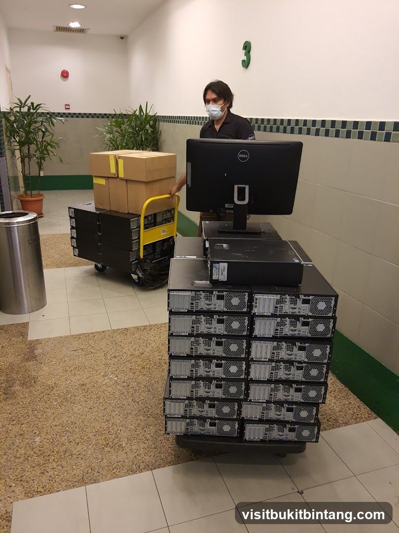 Man moving computer equipment
