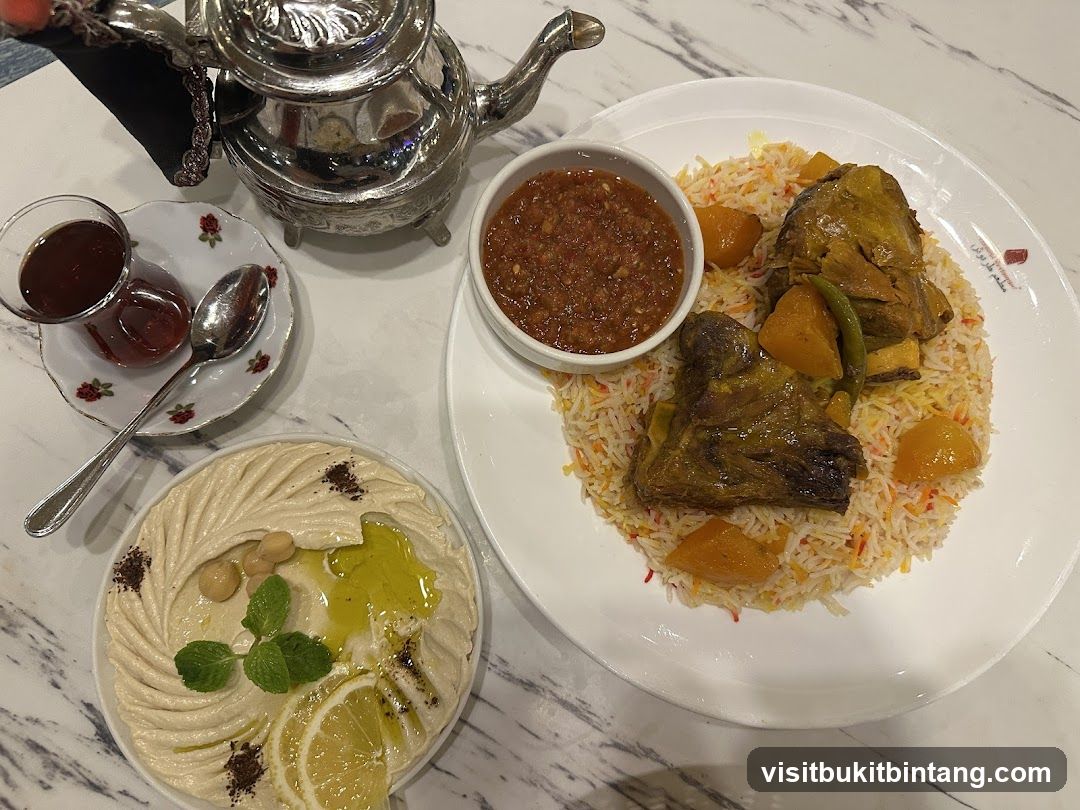 Lamb dish with rice and hummus