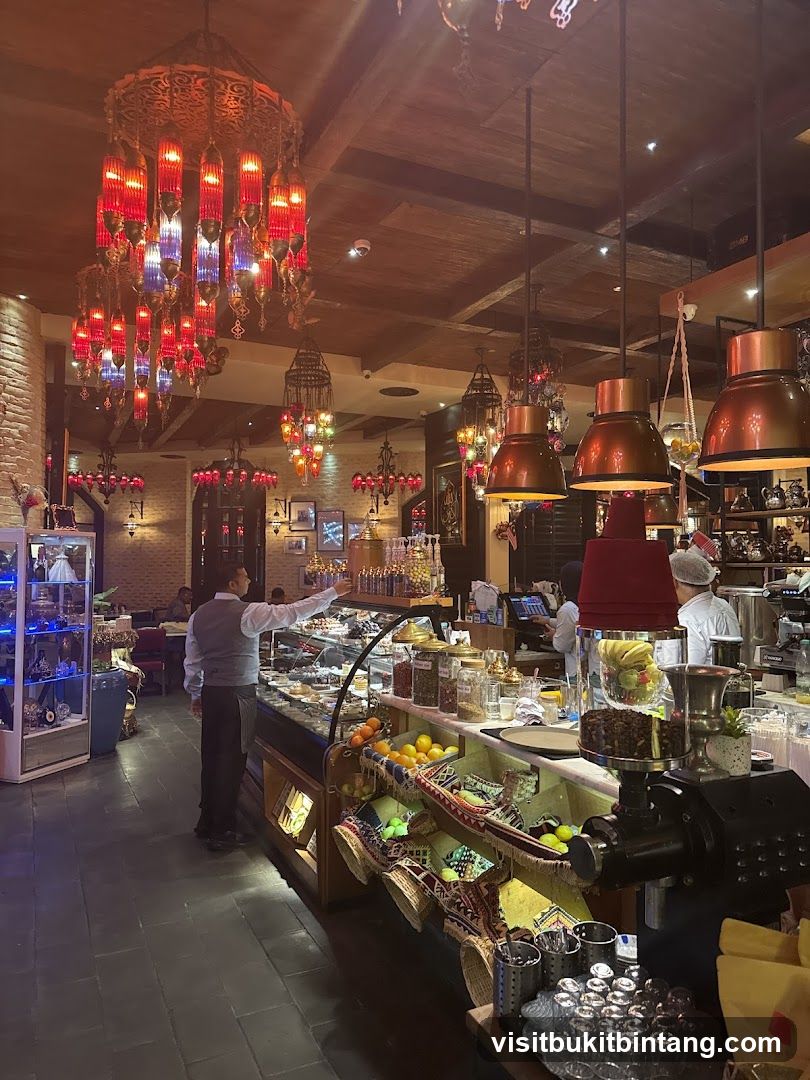Interior of a cafe with ornate lighting and display cases