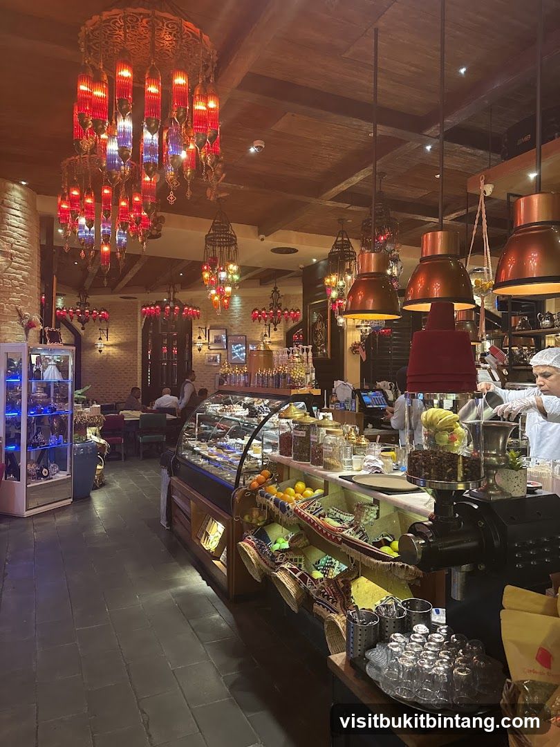 Interior of a cafe with ornate lighting and display cases