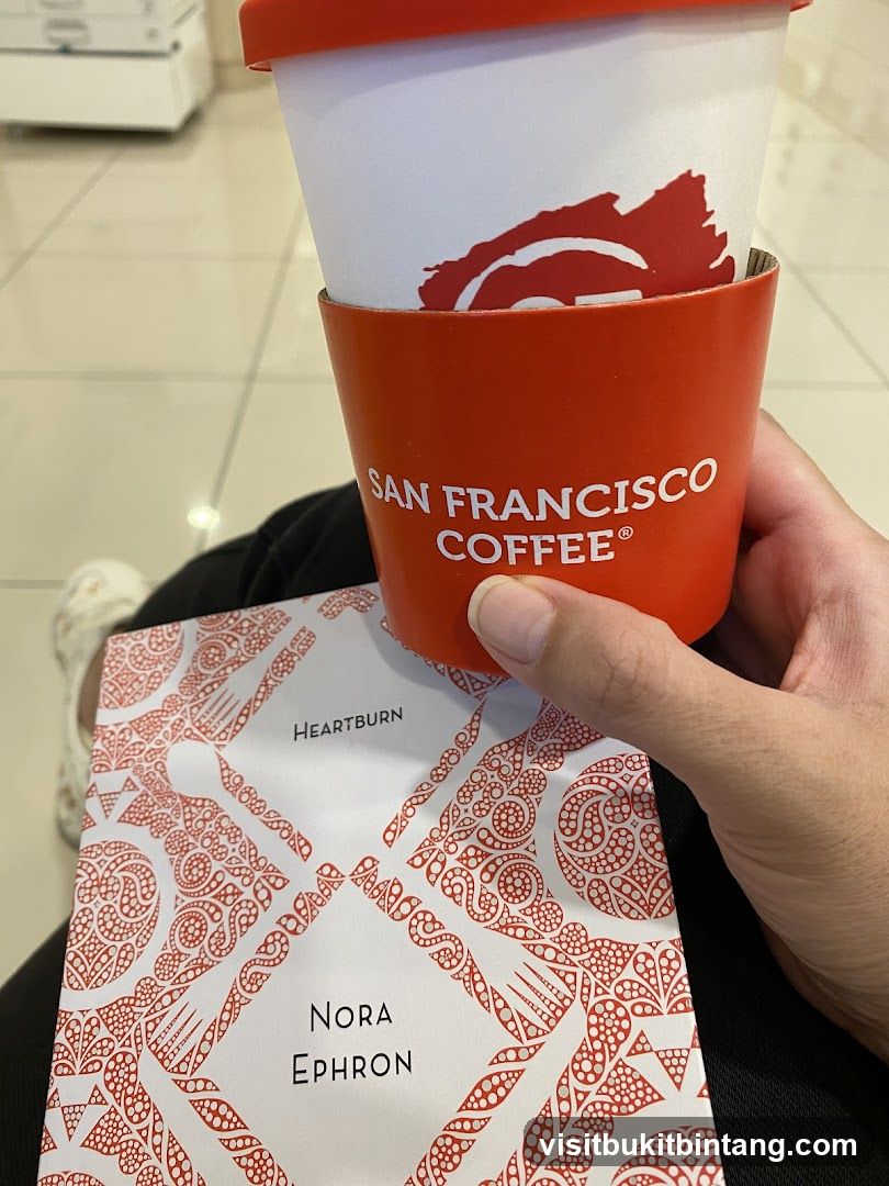 Coffee cup and book