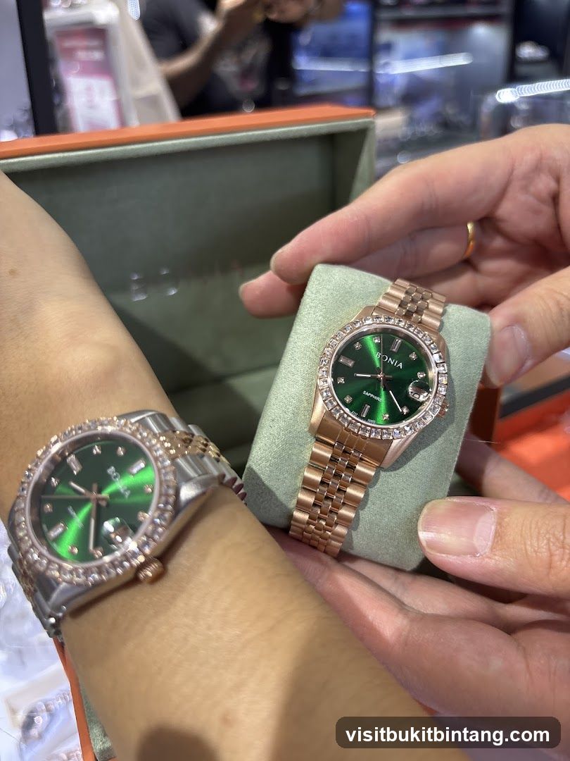 Two watches with green dials and diamond bezels