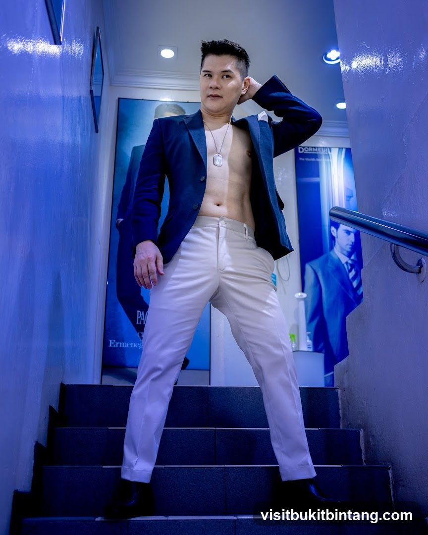 Man posing on stairs