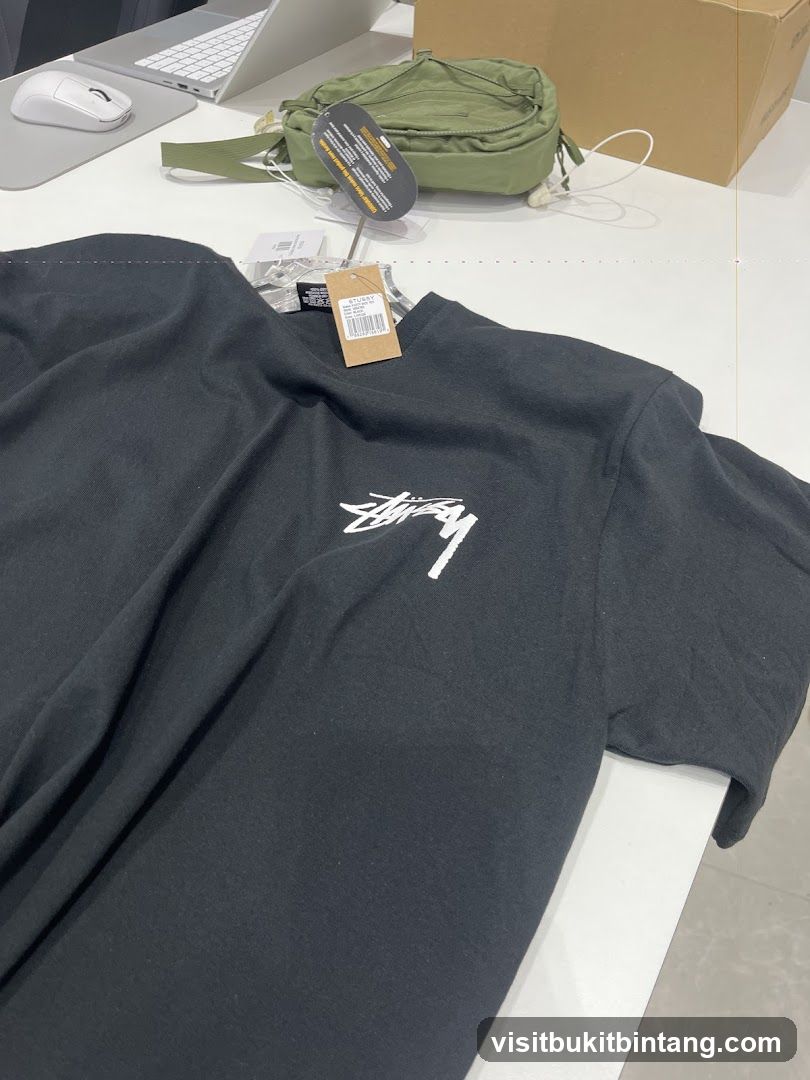 Black T-shirt with Stussy logo