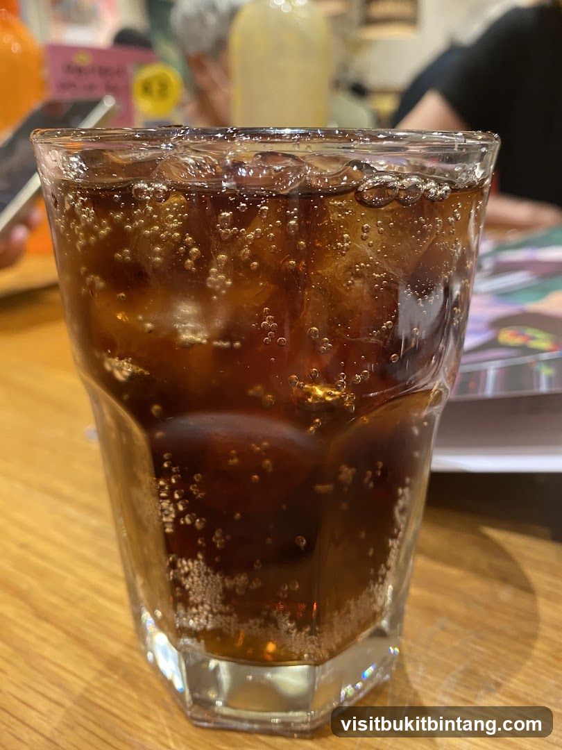Glass of cola with ice
