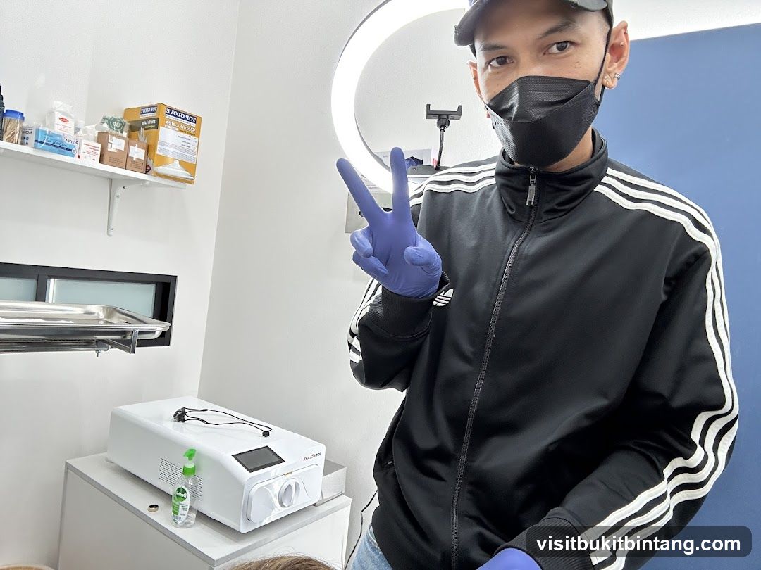 Person in a mask and gloves giving a peace sign