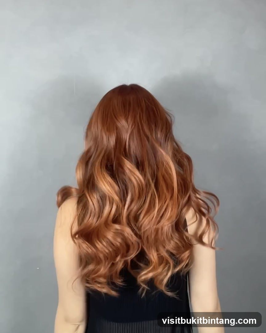 Woman with long, wavy, copper-toned hair