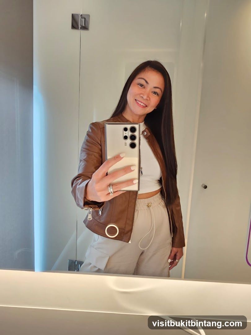 Woman taking a selfie in a mirror