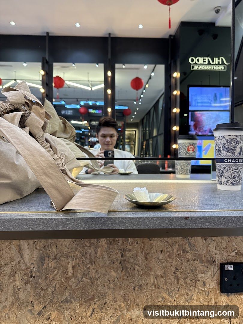 Counter with a person reflected in the mirror