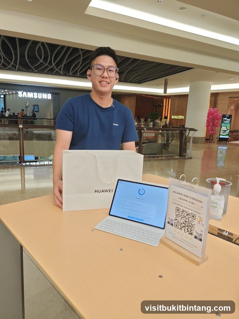 Man with Huawei Tablet and Bag