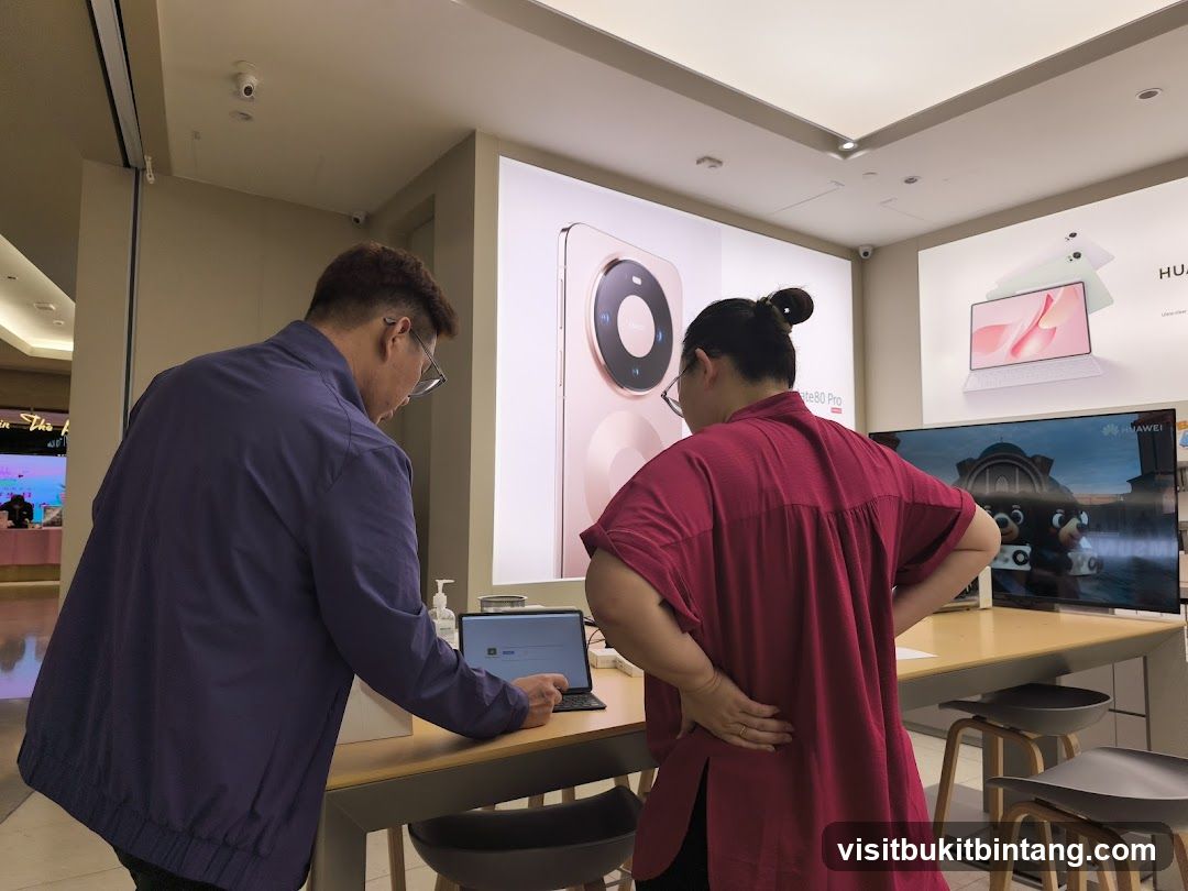 Customers browsing electronics in a store