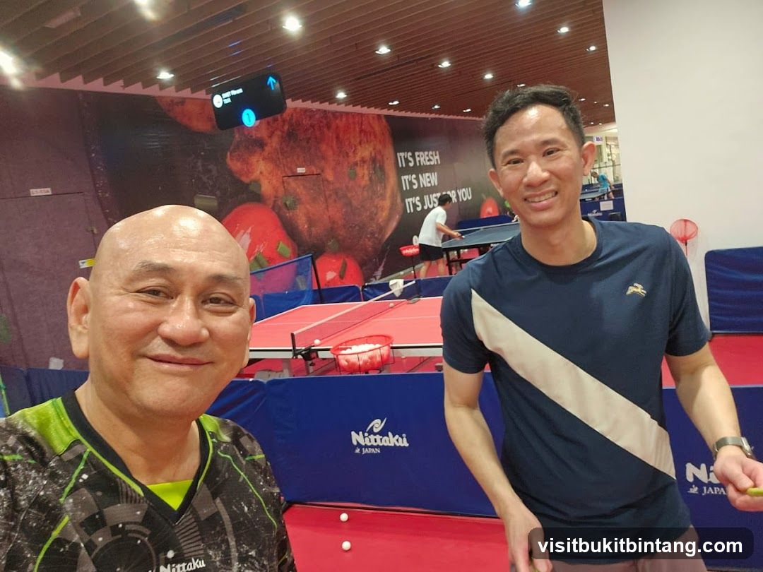 Two men playing table tennis