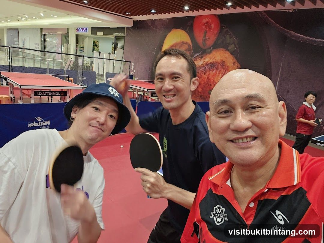 Three men playing table tennis