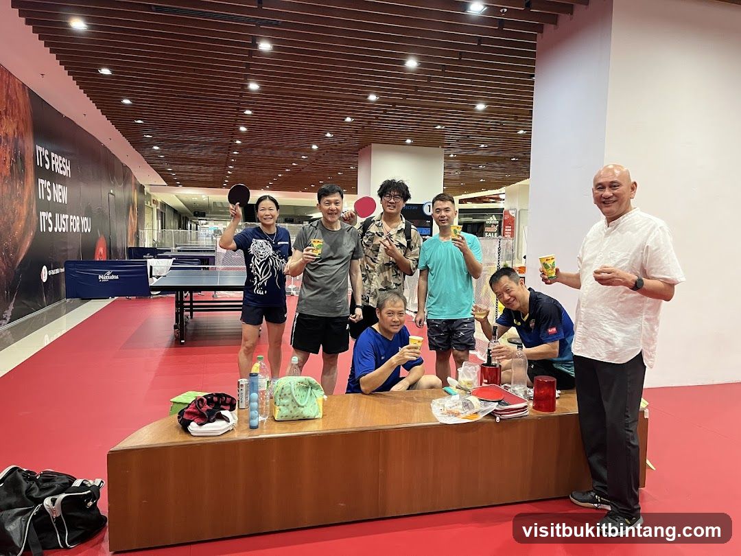 Group of people celebrating at a table tennis venue