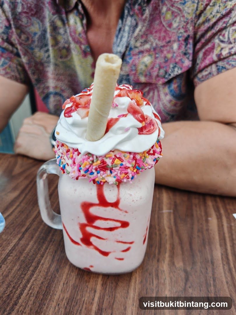 Strawberry Milkshake with Sprinkles and Wafer Stick