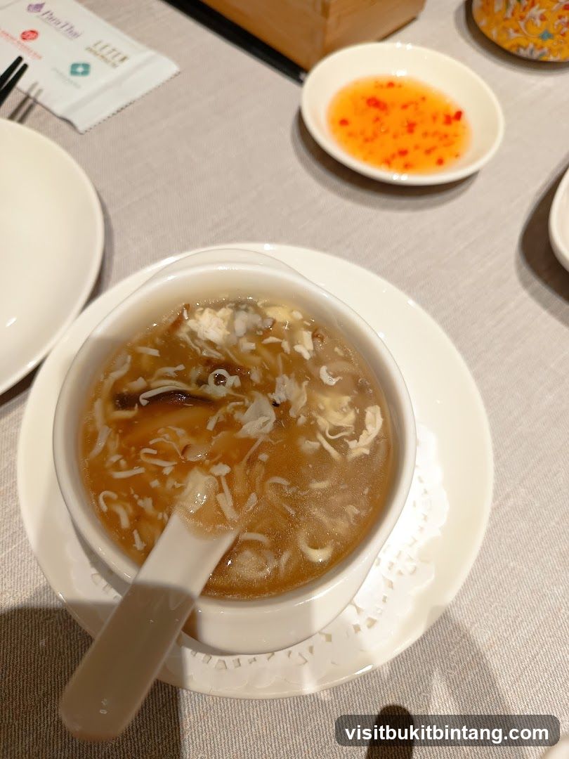 Soup with Spoon and Dipping Sauce