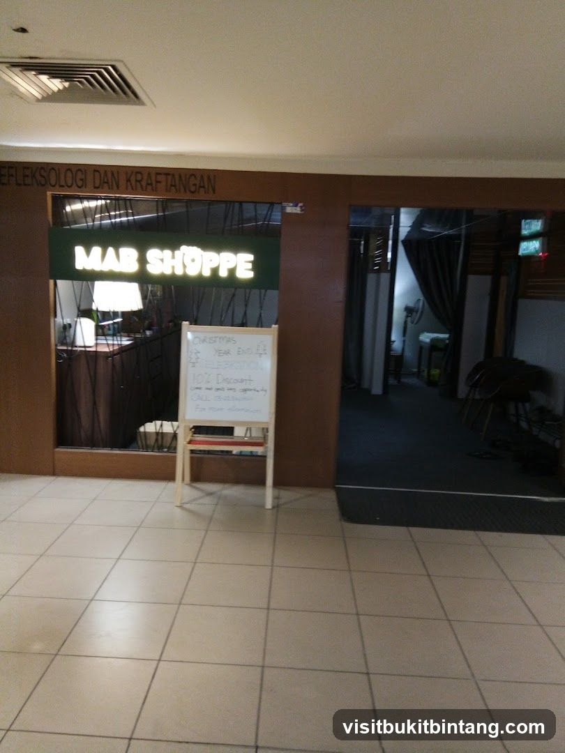 MAB SHOPPE Storefront with Whiteboard Advertisement