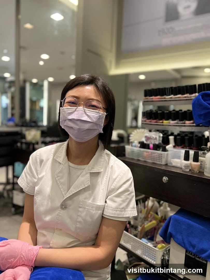 Nail Technician Wearing Mask and Gloves