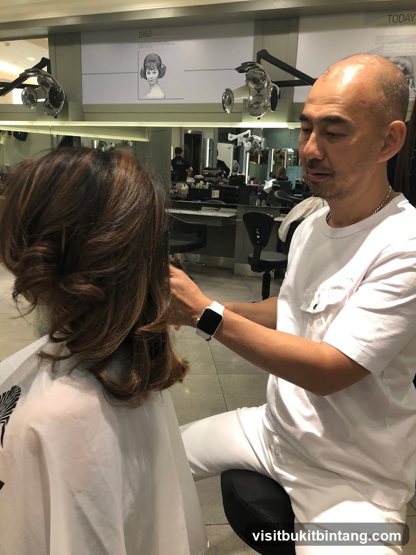 Hairdresser styling a client's hair