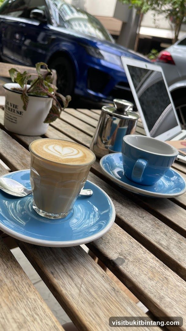 Coffee and Laptop on Outdoor Table