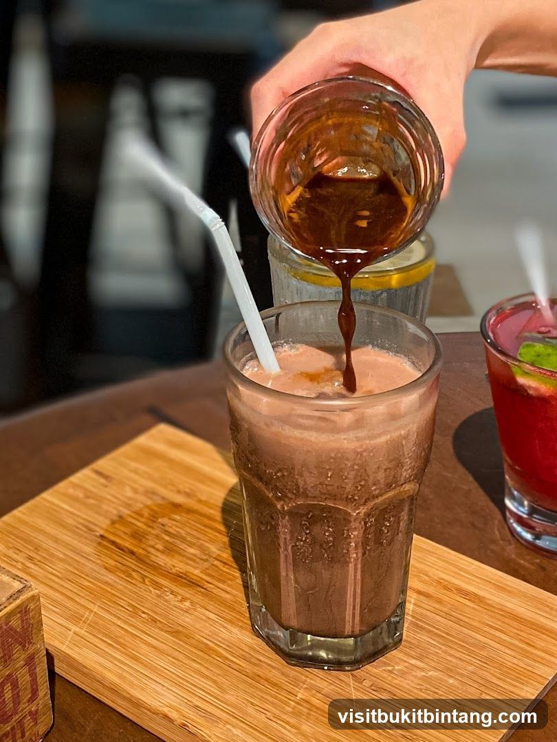 Pouring Espresso into Chocolate Drink