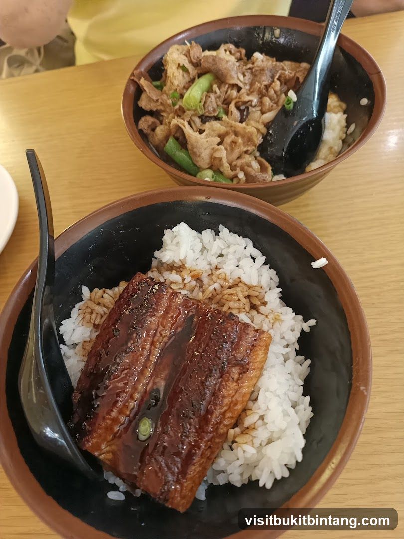Two bowls of rice with toppings
