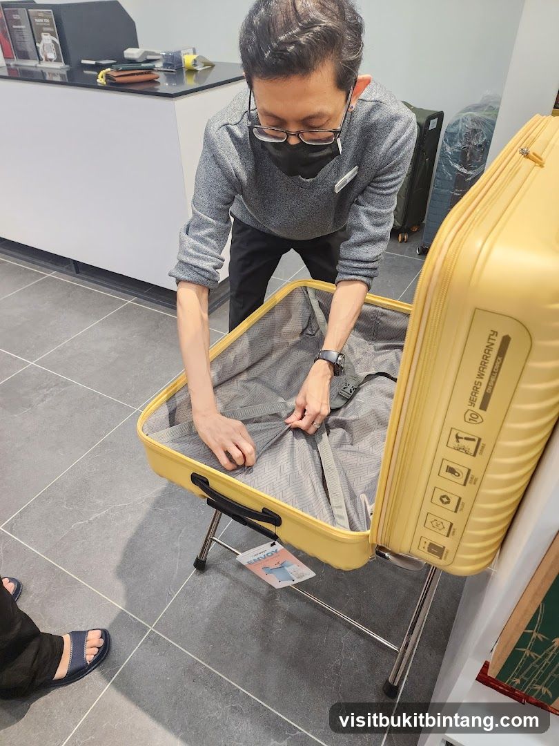 Salesperson showing a suitcase