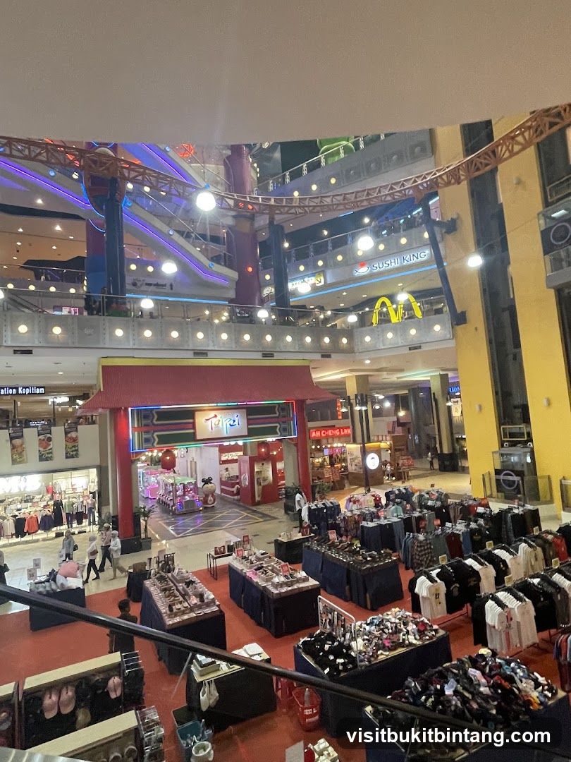 Indoor shopping mall with various stalls and shops